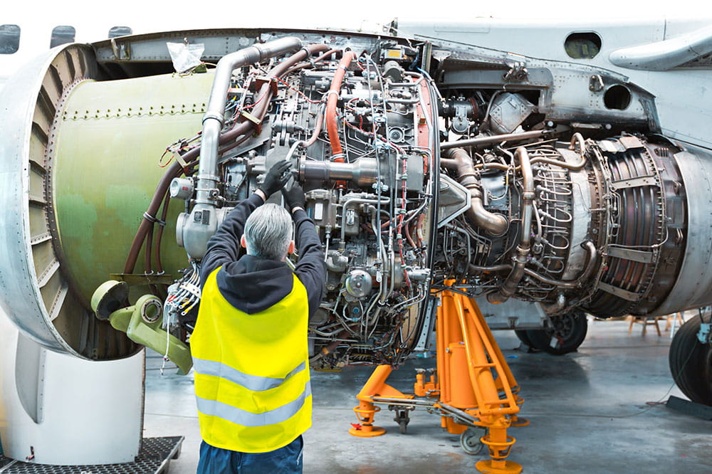 Aircraft maintenance illustrating Freudenberg’s durable sealing solutions aimed at minimizing Aircraft On Ground (AOG) incidents and operational costs.